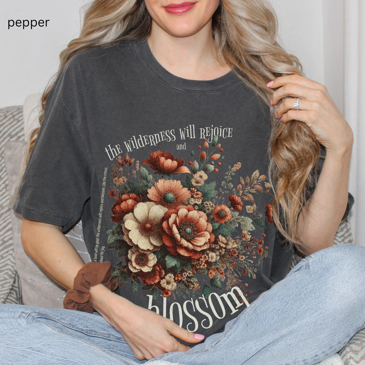 Christian t-shirt with boho design and Bible verse saying the wilderness will blossom in Comfort Colors pepper color