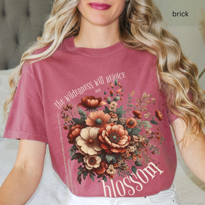 Christian t-shirt with boho design and Bible verse saying the wilderness will blossom in Comfort Colors brick color