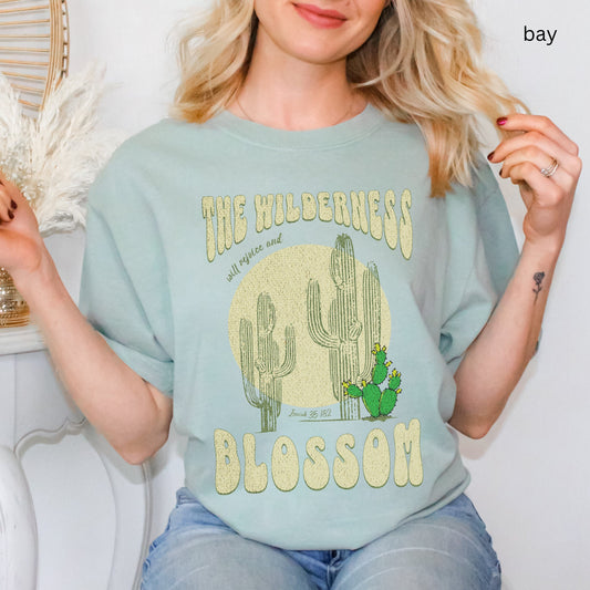 Christian t-shirt with boho design and Bible verse saying the wilderness will blossom