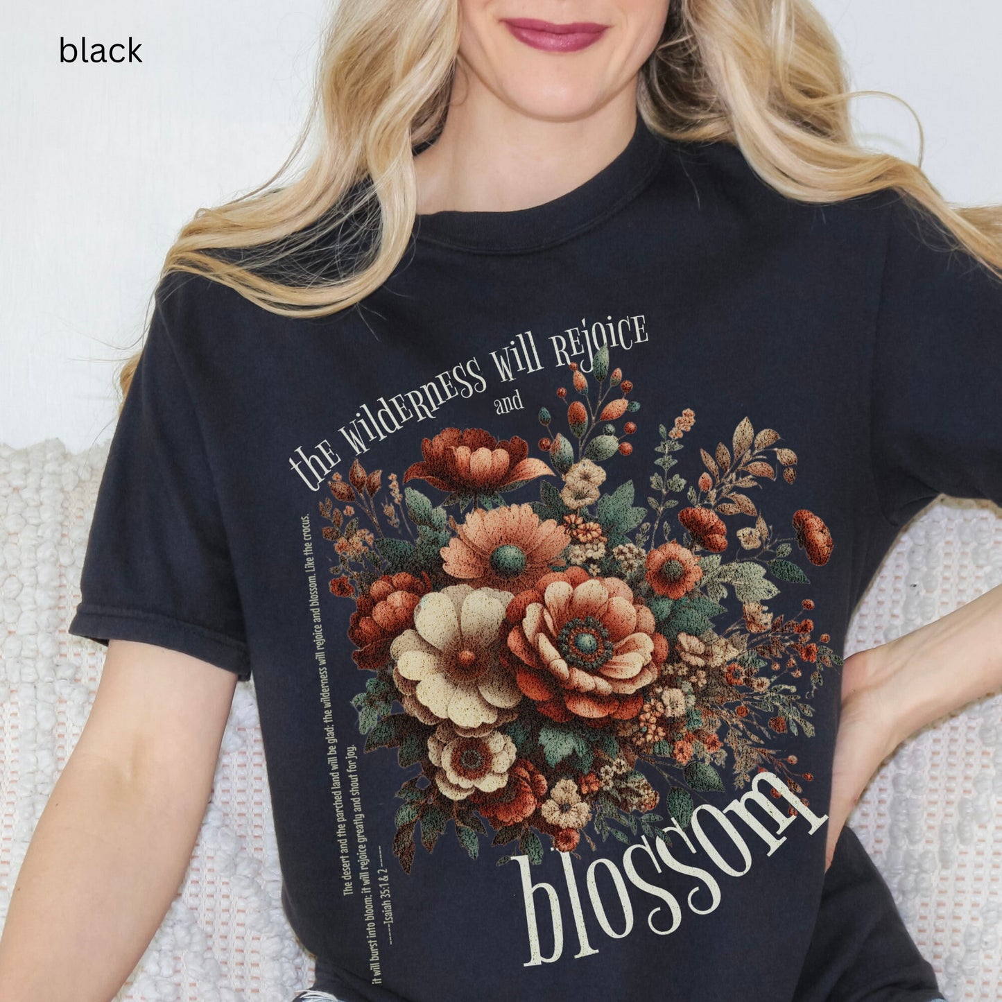 Christian t-shirt with boho design and Bible verse saying the wilderness will blossom in Comfort Colors black color