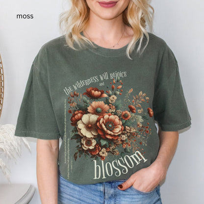 Christian t-shirt with boho design and Bible verse saying the wilderness will blossom in Comfort Colors moss color